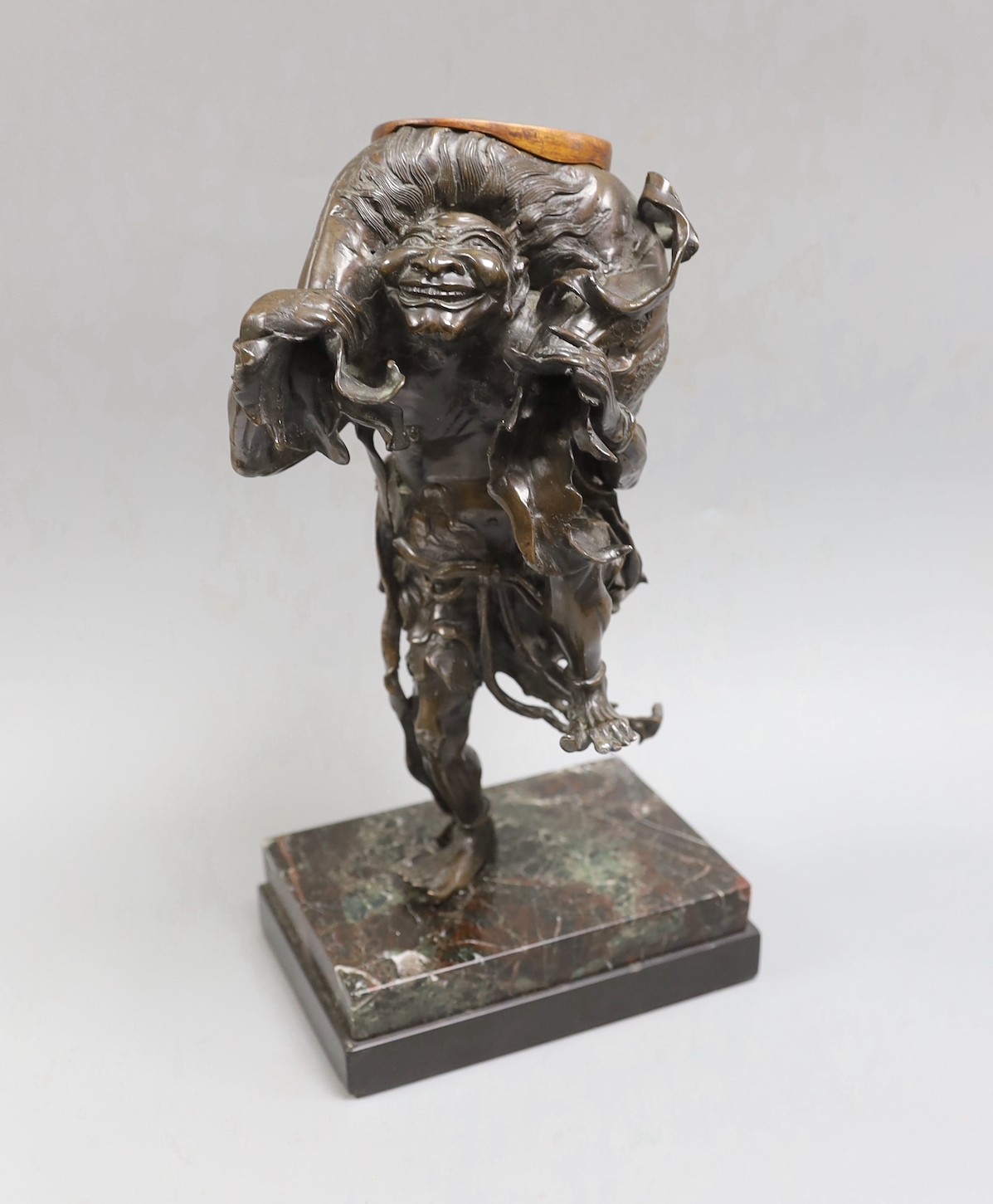 A Meiji period Japanese bronze figural censer, study of a demon, 31cm